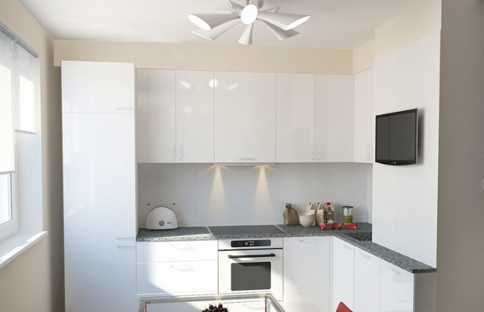 Hvid er måske ikke den mest praktiske farve til køkkenet, men det spiller godt at udvide rummet.